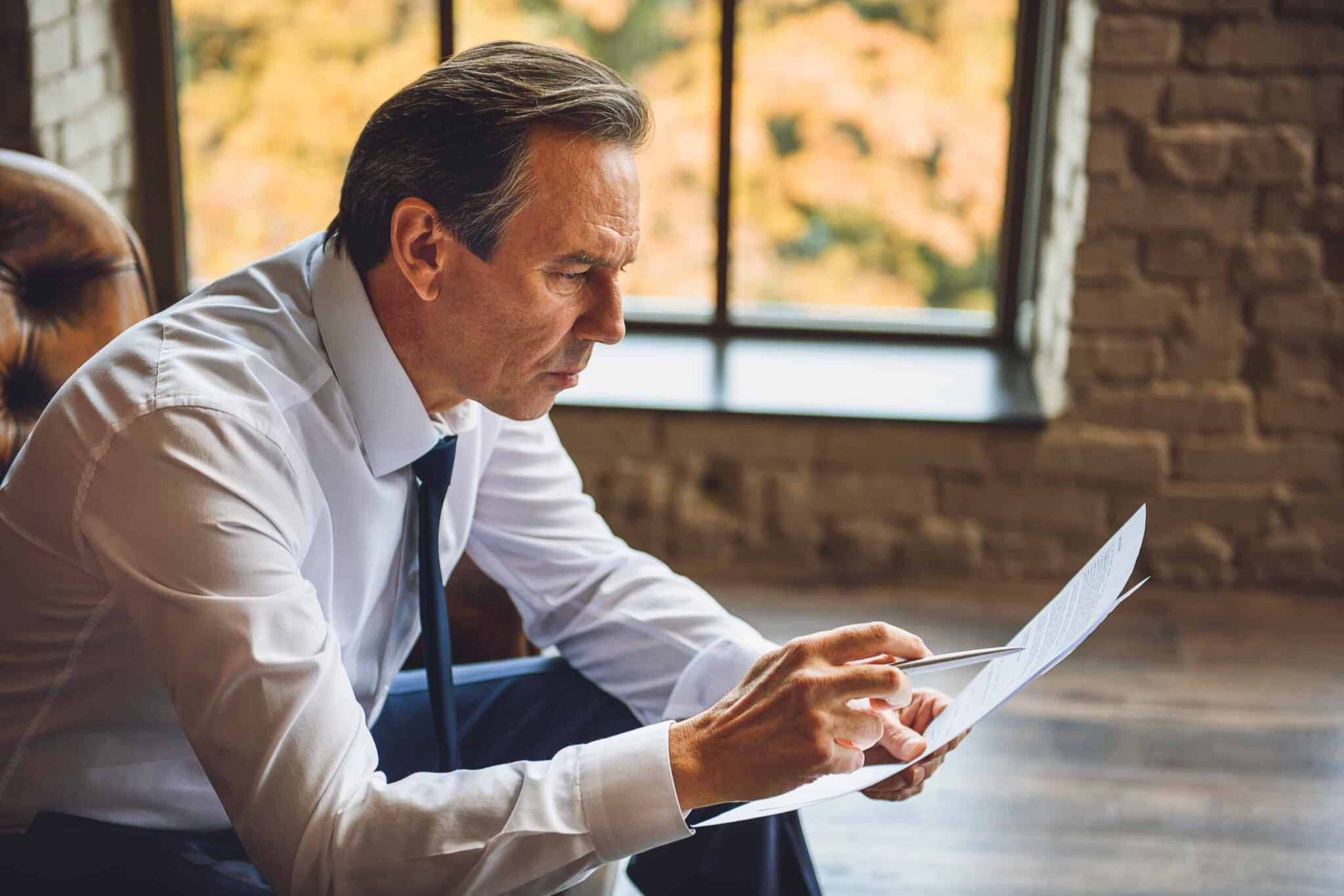 man reading documents
